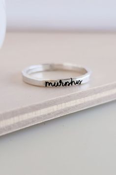 Our custom name rings are the perfect addition to your ring stack! These personalized rings can be engraved with any name or date that means something to you & make an incredible jewelry gift for friends, mom birthday gift or personalized bridesmaid gift! Shop our custom name jewelry & minimalist stacking rings here! Minimalist Hammered Engraved Promise Ring, Sterling Silver Hammered Engraved Promise Ring, Sterling Silver Stackable Rings Gift, Hammered Sterling Silver Engraved Promise Ring, Hammered Sterling Silver Promise Ring, Name Rings Silver, Mom Jewelry Personalized, Personalized Memorial Gifts, Personalized Engraved Gifts