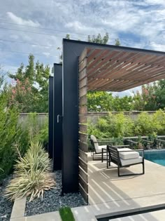 an outdoor covered patio next to a swimming pool