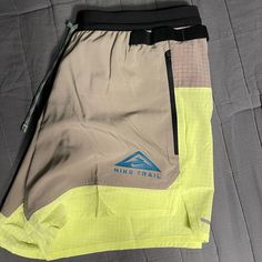 Nike Size M Running Shorts 80% Polyester 20% Spandex Dri Fit Technology Standard Fit 5” Seams With Side Pockets And One Back Pocket. Inside Mesh Briefs Attached. Color Block Neon Green And Gray With Black Waist Band. Brand New, Not Worn With Tags. Smoke/Drug/Pet Free Household. Green Moisture-wicking Shorts For Hiking, Nike Bottoms With Built-in Shorts For Outdoor Activities, Nike Stretch Nylon Bottoms, Green Stretch Nike Bottoms, Nike Moisture-wicking Shorts For Outdoor Activities, Nike Functional Bottoms With Built-in Shorts, Nike Shorts For Outdoor Activities, Functional Short Bottoms For Hiking, Nike Breathable Short Length Bottoms