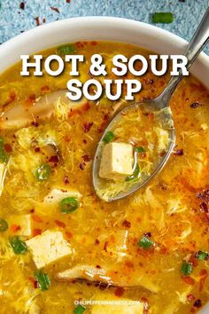 a bowl of hot and sour soup with a spoon