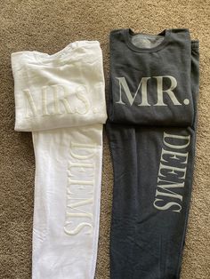 two t - shirts laying on the floor next to each other with mr and mrs written on them