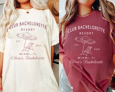 two women wearing club bachelorette t - shirts, one in red and the other in white