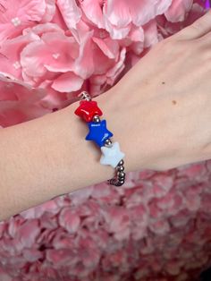 Show your love for your country with these gorgeous patriotic beaded stretch bracelets! Available in gold or silver tone, these stretch bracelets feature a variety of patriotic words and designs. Perfect for any occasion and a great way to add a touch of patriotism to your outfit. Patriotic Words, Your Outfit, Beaded Stretch Bracelet, Love Bracelets, Blue Star, New Arrival Dress, Stretch Bracelets, Silver Bracelets, Silver Tone