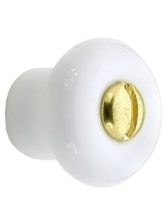 a white door knob with a gold plated handle