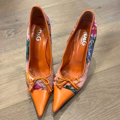 Dolce & Gabbana Orange Flora Tropical Scarpa Women's High Heels Pumps Size 40.5 Well Loved But In Good Condition! Condition: Well Loved Retail: $365 Size: 40 1/2 Heel: 3 1/2" Tall Luxury Designer Floral Print Heels, Dolce And Gabbana Flower Heels, Dolce And Gabbana Gold Heels, Orange Leather Heels With 4-inch Heel, Shoes Dolce Gabbana, Multicolor Floral Print High Heels, Dolce Gabbana Shoes, Heels Pumps, High Heel Pumps