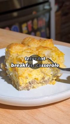 a white plate topped with a piece of breakfast casserole on top of a wooden table