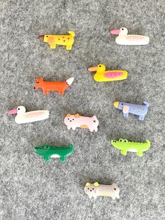 there are many small toy animals on the carpet