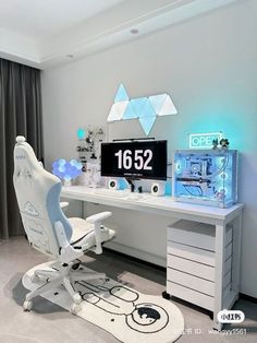 a white desk with a computer on top of it