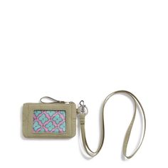 The Zip ID Lanyard has space for cards, an ID window, a key ring and a hands-free lanyard. Outlet Exclusive Exterior features an ID window Interior features a slip pocket Key ring Attached lanyard for hands-free use Badge clip Zip closure. Dimensions: 5. 0" w x 3. 0" h Handle/Strap strap length 19. 5" Vera Bradley Outlet Zip ID Lanyard in Deep Lichen Green Top Gifts For Women, Window Interior, Id Lanyard, Make Her Smile, Top Gifts, Id Badge, Badge Holders Lanyard, Travel Style, Hands Free