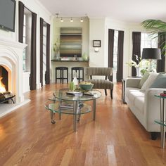 a living room filled with furniture and a fire place