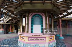 an ornately decorated gazebo stands in the middle of a courtyard at disney's animal kingdom