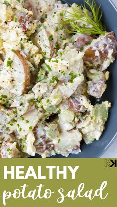 healthy potato salad with herbs in a blue bowl