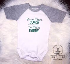 Excited to share this item from my #etsy shop: You Call Him Coach, I Call Him Daddy, Coach's Kid, Sports Bodysuit, Daddy Coach, Baby Bodysuit #sportsonesie #daddyonesie #youcallhimcoach #daddycoach #coachskid #babyclothing #infantclothing #babygift #customonesie White Cotton Sports Bodysuit, White Cotton Sporty Bodysuit, Sporty White Cotton Bodysuit, White Sports Onesie With Letter Print, White Sporty Onesie For Sports, Casual White Onesie For Sports, White Casual Onesie For Sports, Sports Bodysuit, Custom Onesies