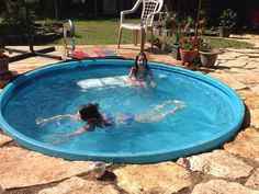 two children playing in a swimming pool