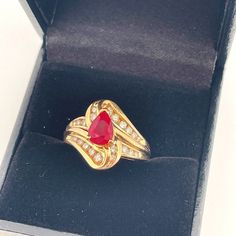 Appraisal Report included with your purchase.  Here we have a superb natural earth mined ruby and sparkly diamond ring circa 1970.  This exceptional vivid red ruby ring is a size 5 1/4 US.  In total it weighs approximately 5.5 grams. The ruby and diamond set face of the ring measures 9/16" long down the finger with a rise of 5/16" off the hand (15mm, 8mm).  It is in lovely condition and is ready to gift or to wear.  The fine gem quality ruby in this ring is a gorgeous color being a vivid red and Unique Ruby Rings, Ruby Ring Vintage, Ruby Anniversary, Engagement Ring Unique, Ring Ruby, Ruby Engagement Ring, Red Ruby, Diamond Set, Ring Unique