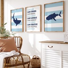 two framed shark pictures hang on the wall above a wicker chair in a white room