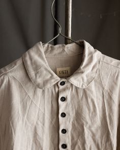 Men's linen shirt JOHN This shirt is made of 100% natural high-quality linen, egg heavy linen is at the pictures. It has a button closure with tightly placed buttons, rounded collar, straight hem and no cuffs. Collar and sleeve hems are hand stitched with natural linen thread. Buttons are made of hand dyed coconut or palm tree. All the materials are prewashed to avoid shrinkage. Total length is 74cm. Vintage Linen Shirt With Relaxed Fit, Classic Cream Linen Shirt, Neutral Collared Linen Shirt, Cream Linen Tops With Buttons, Cream Linen Top With Buttons, Vintage Linen Shirt With Buttons, Vintage Linen Shirt With Button Closure, Vintage Collared Linen Shirt, Vintage Linen Collared Shirt