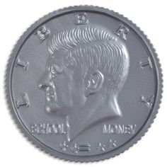 a close up of a metal coin with a man's face on it