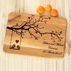 personalized cutting board with two birds on a tree branch and heart shaped oranges