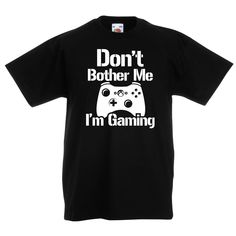 "Step into game mode with our extraordinary Gaming T Shirt. This head-turning gamer tee has been specifically crafted for those passionate young gamers who know that real Dont Bother Me Im Gaming! 🎮💥  This isn't just your average shirt; it's a statement, a lifestyle. Designed with vibrant graphics, it's the perfect top for any screen warrior. An absolute must-have for every kid's gaming top collection  Crafted with exceptional quality, the shirt is made from soft, smooth and exceptionally durable DTF ink. This ensures that your tee not only feels amazing on the skin but also offers superior longevity, maintaining the perfect balance between comfort and durability. Stand out in the crowd with our unique and trendy gaming Tshirt.🛡️🔝  Beyond just looking good, this shirt is also breathabl Black Gamer T-shirt With Letter Print, Gamer Style Short Sleeve Tops With Funny Text, Black Gaming Tops With Graphic Design, Gamer Tops With Letter Print, Black Gamer Tops With Logo Print, Black Gamer Top With Funny Text, Black Gamer T-shirt With Funny Text, Gaming T Shirt, Game Mode