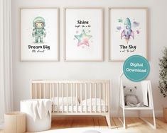 a baby's room with three posters on the wall