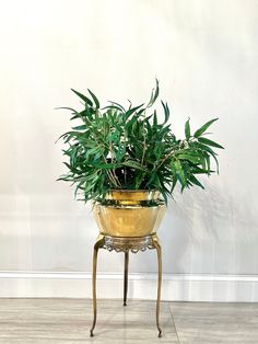 a potted plant sitting on top of a metal stand