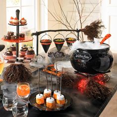 a table topped with lots of desserts and drinks