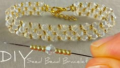 the bead bracelet is being worked on by someone using a needle to make it