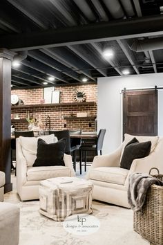 a living room filled with furniture and a brick wall