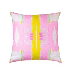 a pink and yellow pillow with an abstract design on the front, sitting against a white background