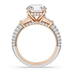 an engagement ring with two tone gold and white diamonds on the band, set in 18k rose gold