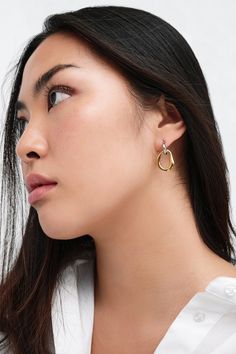 Our Suki Two-Toned Hoops are a minimalist exploration of duality, featuring two mixed metals, handcrafted from brass with rhodium and 18k gold plating, entwined in elegant harmony. True to her contrasting style, Suki is the perfect accessory for days and nights, casual and formal events, now and forever. Each pair includes a Marcella-branded vegan leather travel case for safe storage and easy travel.[SPLIT] Available in one size. Approximately 1” (2.5 cm) in height. Brass with 18KT yellow gold p Swim Jewelry, Tunic Hoodie, Easy Travel, Now And Forever, Leather Travel, Mixed Metals, Travel Case, Formal Event, Vegan Leather