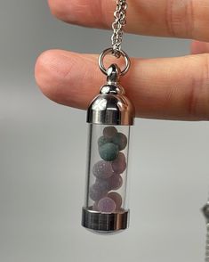 Stainless steel and glass vial pendant with grape agate / botryoidal amethyst. The pendant is roughly 45mm and the chain is 20 inches. Grape agate from Indonesia Agate Round Pendant Crystal Necklace For Healing, Agate Round Pendant Necklace For Healing, Agate Crystal Necklace With Round Pendant For Healing, Spiritual Healing Crystal Necklace With Lobster Clasp, Healing Metal Pendant Crystal Necklaces, Healing Nickel-free Necklaces With Mineral Crystal, Grape Agate, Mineral Jewelry, Phantom Quartz