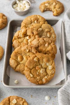 cookies and marshmallows are arranged on a baking tray, ready to be eaten