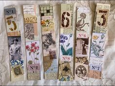 four bookmarks with different designs and numbers on them, all lined up in rows