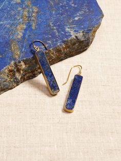 DESTINATION COLLECTION: Designed for dreamers, these pieces reflect the distinctive beauty of the destinations that inspired them, showcasing the striking qualities of semi-precious stones and natural materials as a call to explore- even if only in t Luxury Handmade Lapis Lazuli Jewelry, Elegant Lapis Lazuli Earrings With Natural Stones, Elegant Gold Lapis Lazuli Earrings, Bohemian Lapis Lazuli Earrings For Gift, Lapis Lazuli Dangle Earrings With Natural Stones, Lapis Earrings, Lapis Blue, Soft Toothbrush, Blue Lapis