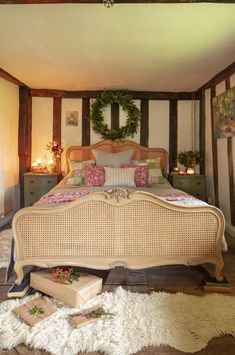 a bedroom with a large bed and white rugs