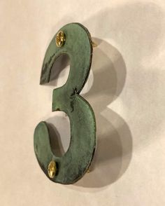 the number three is made out of metal