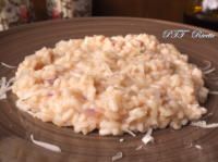 a brown plate topped with rice on top of a table