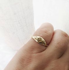 Elegant and unique 14k gold Daffodil signet ring, Vintage style floral wedding band, unique gold wedding ring for the stylish bride to be set with a tiny diamond. * Band width: 1.5 mm, wide part width: 5.5 mm* Thickness: 1.5 mm* Embedded with a one round 1 mm diamond, VS1 F. * Available in 14K or 18K YELLOW, WHITE and ROSE gold.   The price listed is for 14K please contact me for 18K pricing.* available with darkend flower ( please mention in note to seller) * Sizes vary from 5 US to 9 US, inclu Dainty Yellow Gold Signet Ring For Promise, Delicate 14k Gold Engraved Ring, Delicate Engraved 14k Gold Ring, Elegant Signet Ring With Birth Flower For Anniversary, Elegant Anniversary Signet Ring With Birth Flower, Heirloom 14k Gold Engraved Flower Ring, Heirloom Engraved 14k Gold Flower Ring, Delicate Signet Ring For Promise, Delicate Signet Promise Ring