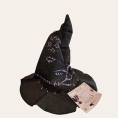 a black witch hat with purple stars on it