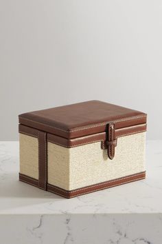 Hunting Season's trunk box has been made from raffia in the label's Colombian studio by local artisans using traditional weaving techniques - a craft that's been passed down through generations. It's traced with smooth tan leather throughout. Use it to organize your home office. Sofa Table Styling, To Go Boxes, Leather Packaging, Champagne Box, Trunk Box, Trunk Boxes, Leather Trunk, Store Room, Organize Your Home