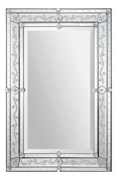 an ornate silver framed mirror on a white background