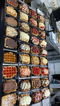 waffles and other pastries are arranged on trays