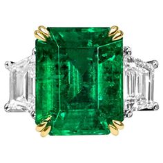 Showcasing an exquisite investment grade emerald cut green natural emerald certified by AGL with top color and top clarity. Based on emerald grading methodology the clarity of the emerald is very rare with practically no imperfections visible to the naked eye. The emerald is exceptionally vibrant and velvety with grade A crystal. The color is truly mesmerizing green and this emerald is overall an excellent stunner. Set with 2 colorless trilliant cut diamonds as side stones Smaragd Ring, Columbian Emeralds, Emerald Cut Diamond Ring, Platinum Diamond Rings, Emerald Diamond Ring, Colombian Emeralds, Stone Engagement Rings, I Love Jewelry, Emerald Jewelry