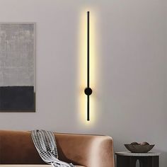 a living room scene with focus on the wall light