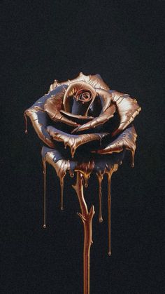 a gold rose with dripping water on it