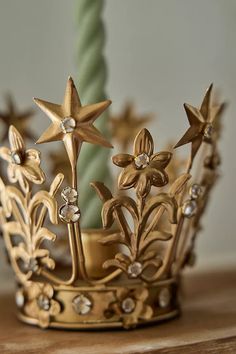 a gold crown sitting on top of a wooden table