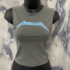 Cotton On Metallica Shirt Brand New Nwt Size Xs Womens Size Xs Shown On Mannequin ***Size Xs & Large Available Metallica Color Blue On Logo! Amazing Quality Stretchy And Conforming To The Body Total Y2k Style! Early 90’s Grunge Punk Fitted Grunge Blue Top, Fitted Graphic Print Casual Tank Top, Casual Fitted Tank Top With Graphic Print, Fitted Casual Tank Top With Graphic Print, Fitted Grunge Tops For Summer, Summer Grunge Fitted Tops, Casual Fitted Tank Top With Letter Print, Fitted Grunge Tops For Spring, Spring Grunge Tank Top