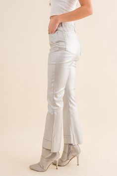 These Silver Metallic Crop Jeans make it easy to stay on trend. Featuring a metallic-coated denim and mid-rise cut, they offer a comfortable stretch fit and look great with raw hem ankle length. Get ahead of the game and add some shine to your wardrobe before they're sold out. Silver Metallic Crop Jean 80% Cotton 18% Viscose 2% Spandex Chic Spring Bottoms With Sheen, Chic Sheen Bottoms For Spring, Chic Spring Sheen Bottoms, Trendy Shimmer Bottoms For Spring, Chic Shimmer Bottoms For Spring, Chic Shimmer Pants For Spring, Metallic Denim Bottoms, Casual Metallic Jeans, Metallic Straight Leg Bottoms For Fall